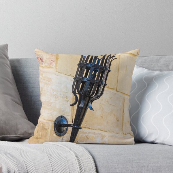Item preview, Antique Black Iron Wall Torch with Spiked Holder Mounted on Rustic Stone Wall designed and sold by Nmallia.