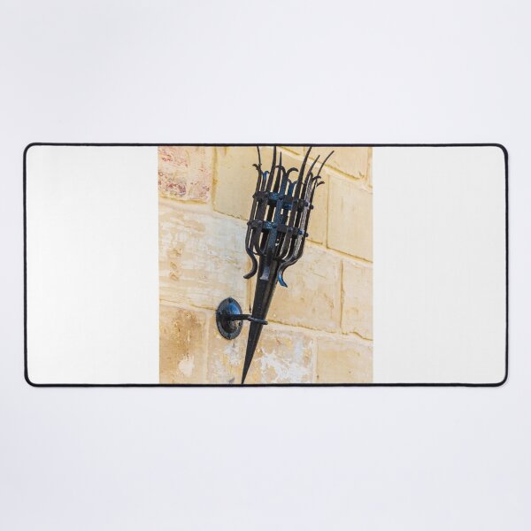 Item preview, Antique Black Iron Wall Torch with Spiked Holder Mounted on Rustic Stone Wall designed and sold by Nmallia.