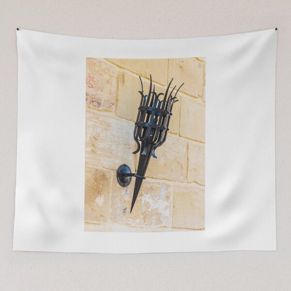 Item preview, Antique Black Iron Wall Torch with Spiked Holder Mounted on Rustic Stone Wall designed and sold by Nmallia.