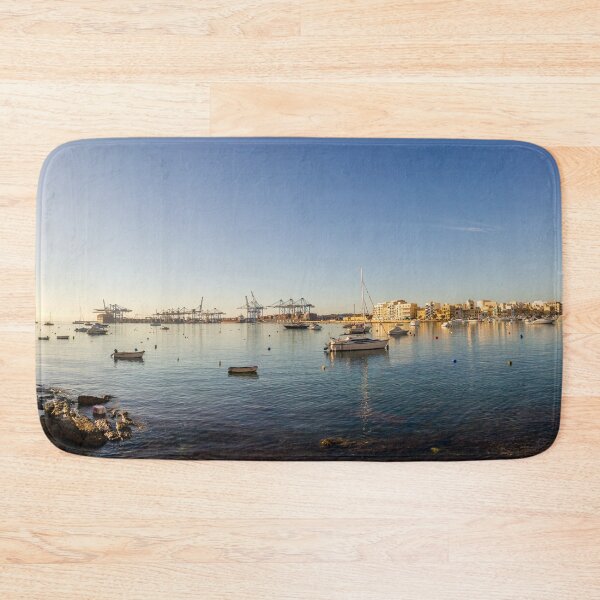 Item preview, Scenic Harbor With Boats and Calm Sea at Sunset Over Coastal Town Waterfront designed and sold by Nmallia.
