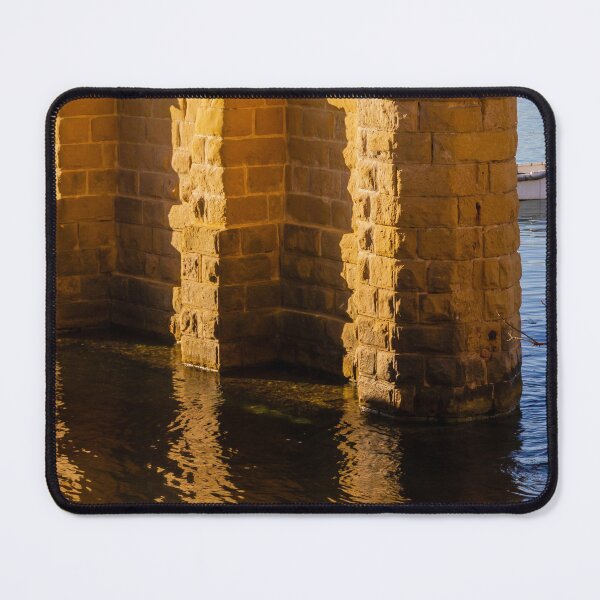 Item preview, Golden Stone Pillars by Calm Harbor Water with Reflective Surface and Sunlit Brick Wall designed and sold by Nmallia.