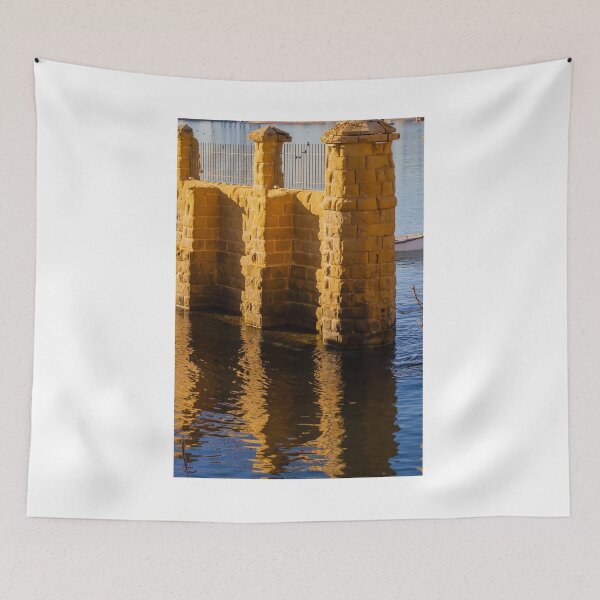 Item preview, Golden Stone Pillars by Calm Harbor Water with Reflective Surface and Sunlit Brick Wall designed and sold by Nmallia.