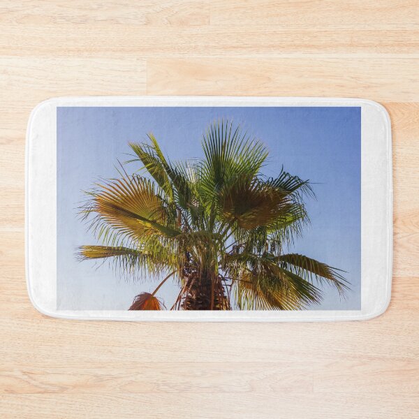 Item preview, Palm Tree Under Clear Blue Sky With Bright Green Fronds and Sunny Light designed and sold by Nmallia.