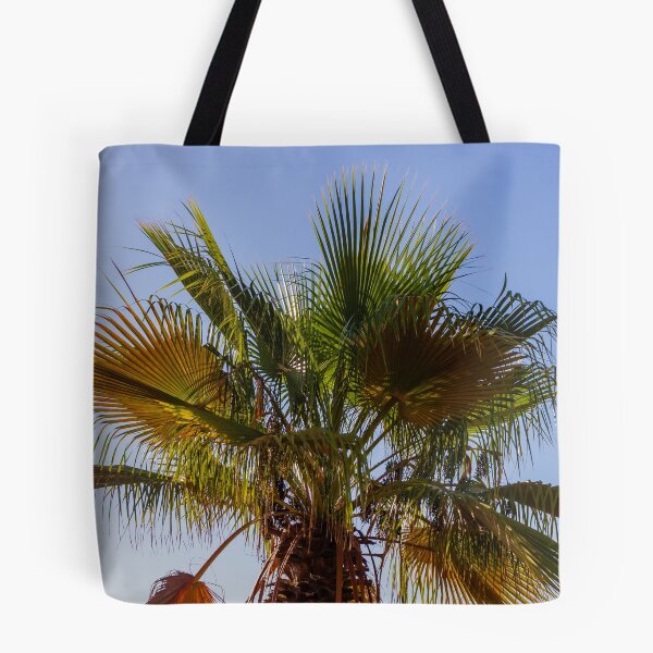 Item preview, Palm Tree Under Clear Blue Sky With Bright Green Fronds and Sunny Light designed and sold by Nmallia.