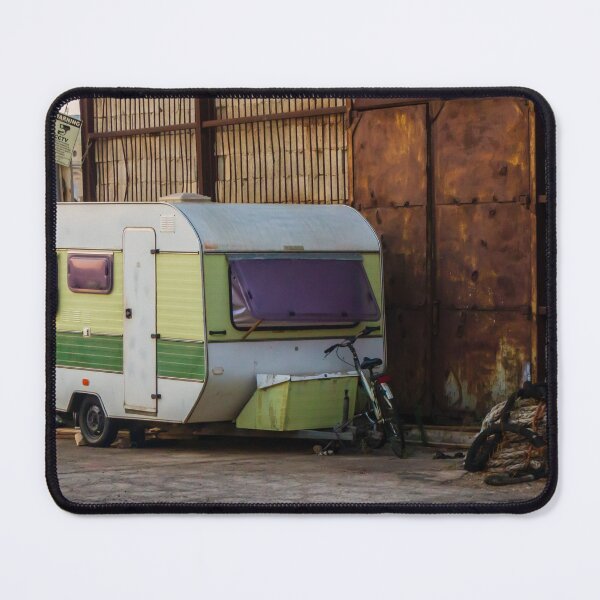 Item preview, Vintage Green Caravan Parked Beside Rusty Industrial Warehouse With Bicycle and Fishing Gear designed and sold by Nmallia.