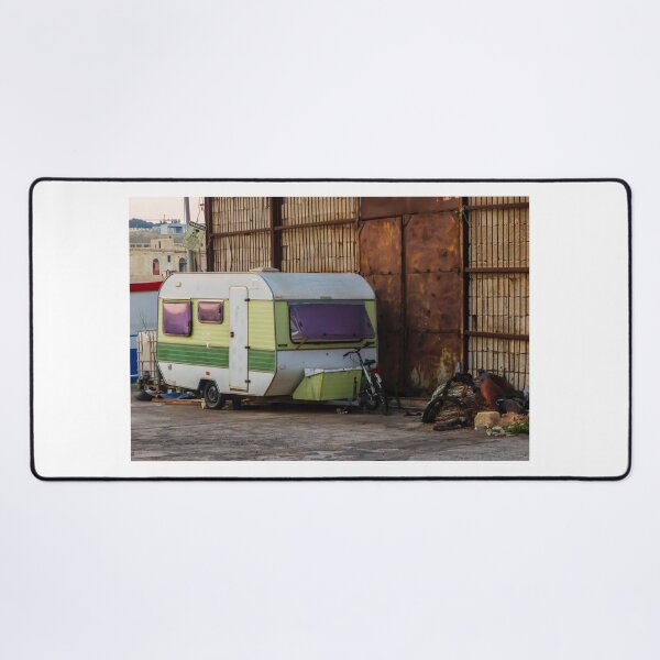 Item preview, Vintage Green Caravan Parked Beside Rusty Industrial Warehouse With Bicycle and Fishing Gear designed and sold by Nmallia.