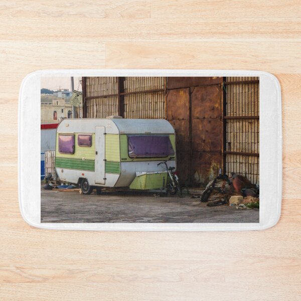 Item preview, Vintage Green Caravan Parked Beside Rusty Industrial Warehouse With Bicycle and Fishing Gear designed and sold by Nmallia.