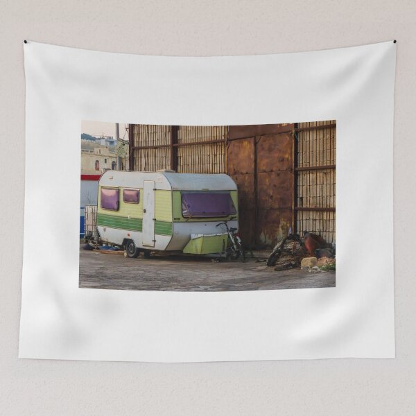 Item preview, Vintage Green Caravan Parked Beside Rusty Industrial Warehouse With Bicycle and Fishing Gear designed and sold by Nmallia.