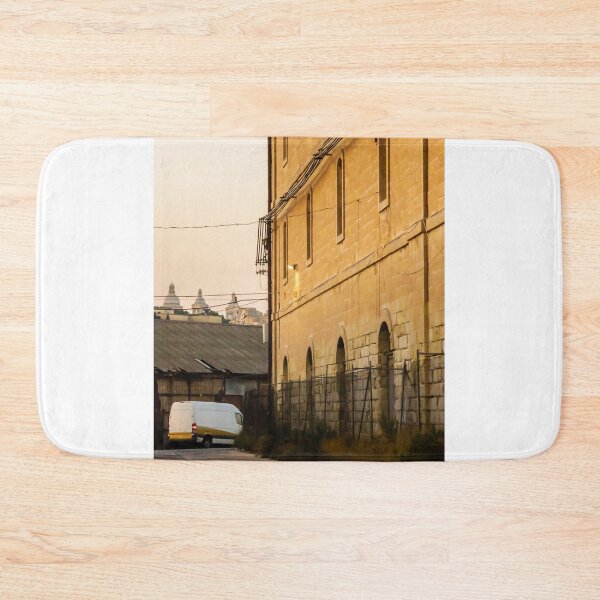 Item preview, Golden Light on Historic Stone Warehouse Alley With Parked Delivery Van at Dusk designed and sold by Nmallia.