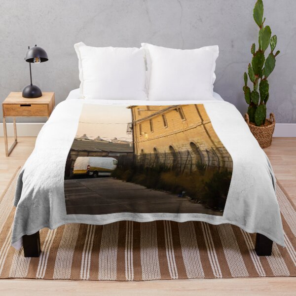 Item preview, Golden Light on Historic Stone Warehouse Alley With Parked Delivery Van at Dusk designed and sold by Nmallia.