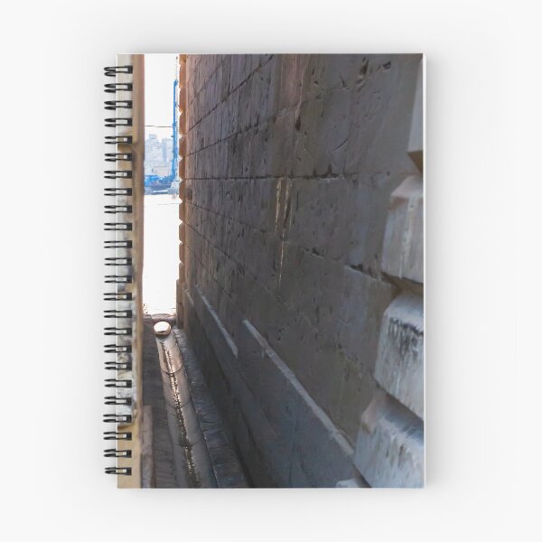 Item preview, Narrow Stone Dockside Gap With Water Channel and Industrial Harbor Visible in Background designed and sold by Nmallia.