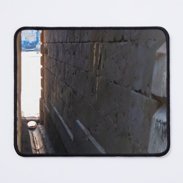 Item preview, Narrow Stone Dockside Gap With Water Channel and Industrial Harbor Visible in Background designed and sold by Nmallia.