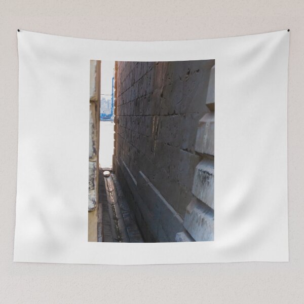 Item preview, Narrow Stone Dockside Gap With Water Channel and Industrial Harbor Visible in Background designed and sold by Nmallia.
