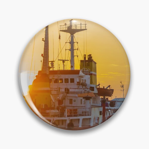 Item preview, Red Cargo Ship Docked at Harbor During Golden Sunset With Industrial Port Cranes in Background designed and sold by Nmallia.