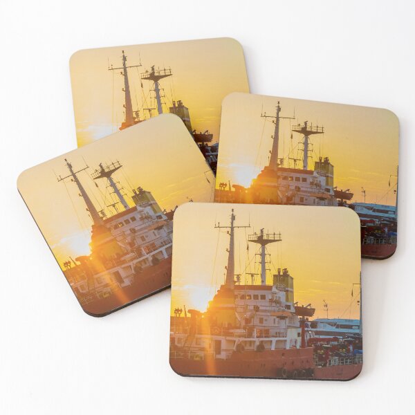 Item preview, Red Cargo Ship Docked at Harbor During Golden Sunset With Industrial Port Cranes in Background designed and sold by Nmallia.
