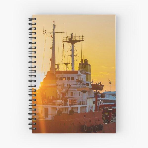 Item preview, Red Cargo Ship Docked at Harbor During Golden Sunset With Industrial Port Cranes in Background designed and sold by Nmallia.