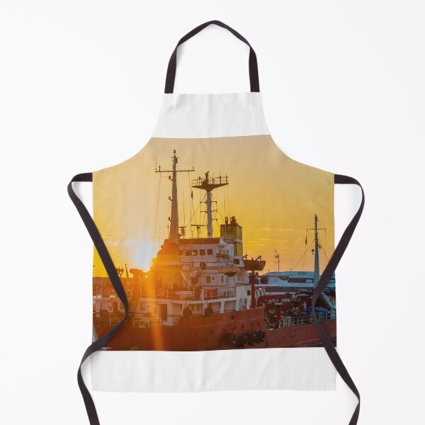 Item preview, Red Cargo Ship Docked at Harbor During Golden Sunset With Industrial Port Cranes in Background designed and sold by Nmallia.