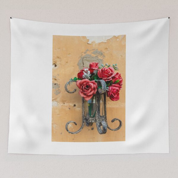 Item preview, Red Rose Bouquet in Rustic Metal Wall Sconce Against Textured Orange Plaster Wall designed and sold by Nmallia.