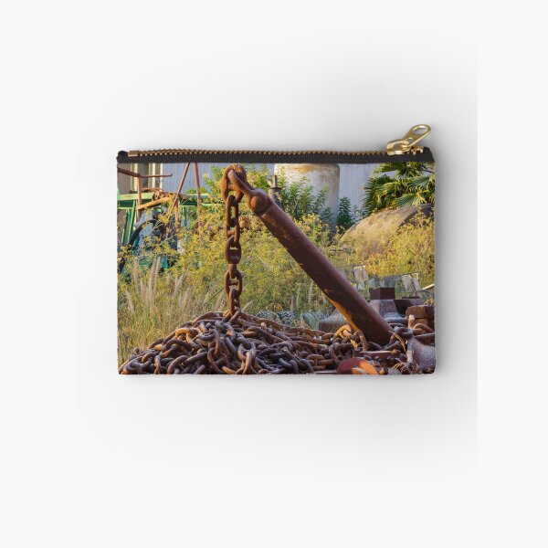 Item preview, Rusted Anchor and Heavy Chain Amid Overgrown Industrial Scrapyard With Machinery and Plants designed and sold by Nmallia.