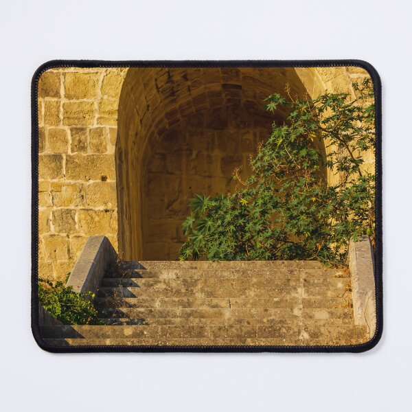 Item preview, Stone Stairs Leading to Historic Stone Archway and Sunlit Wall With Green Foliage designed and sold by Nmallia.