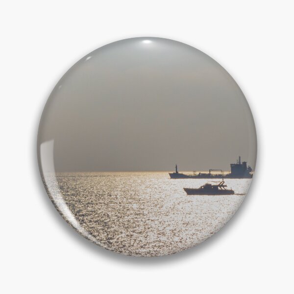 Item preview, Sunlit Ocean Horizon With Silhouetted Cargo Ship And Motorboat Crossing Glittering Water designed and sold by Nmallia.