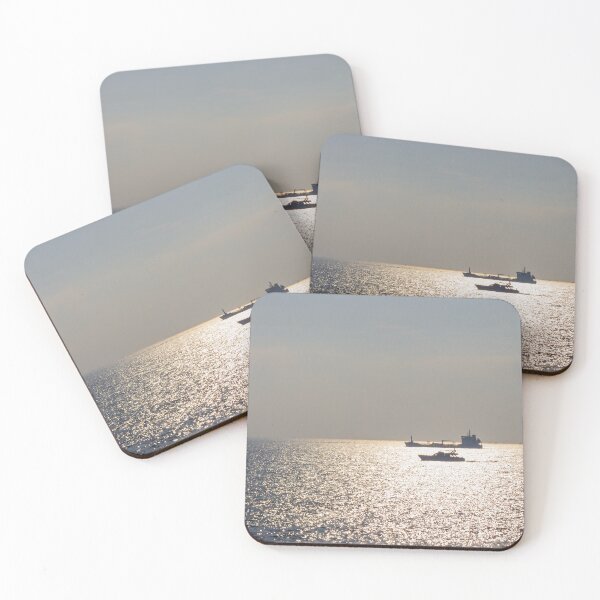 Item preview, Sunlit Ocean Horizon With Silhouetted Cargo Ship And Motorboat Crossing Glittering Water designed and sold by Nmallia.