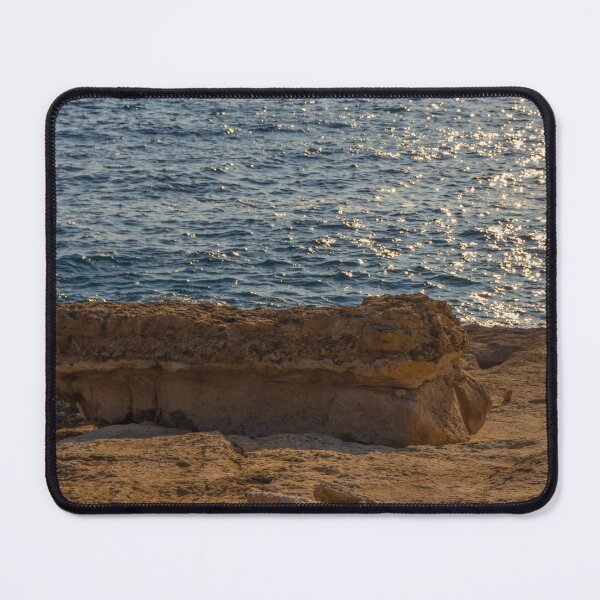 Item preview, Sunlit Coastal Rock Ledge Over Calm Ocean Waves With Sparkling Water at Sunset designed and sold by Nmallia.