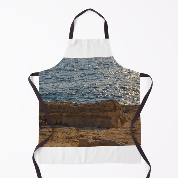 Item preview, Sunlit Coastal Rock Ledge Over Calm Ocean Waves With Sparkling Water at Sunset designed and sold by Nmallia.