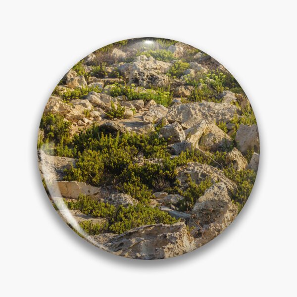 Item preview, Rocky Coastal Terrain With Low Green Shrubs and Sunlit Limestone Boulders designed and sold by Nmallia.