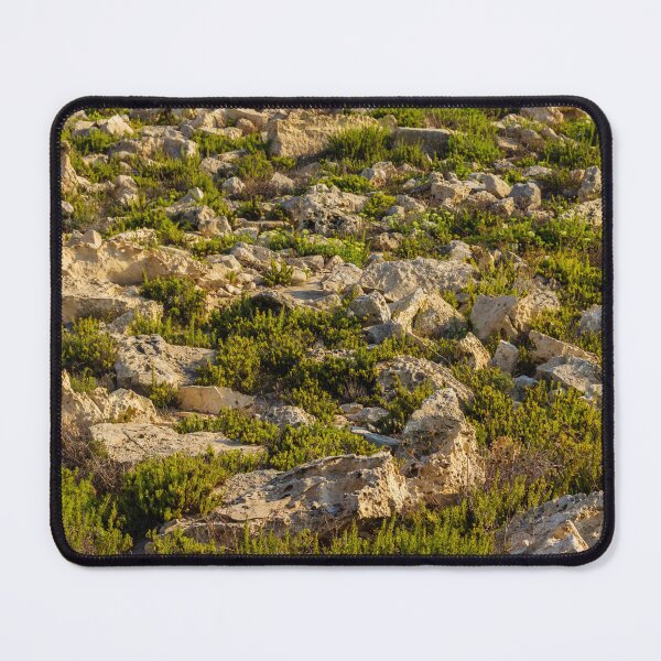 Item preview, Rocky Coastal Terrain With Low Green Shrubs and Sunlit Limestone Boulders designed and sold by Nmallia.