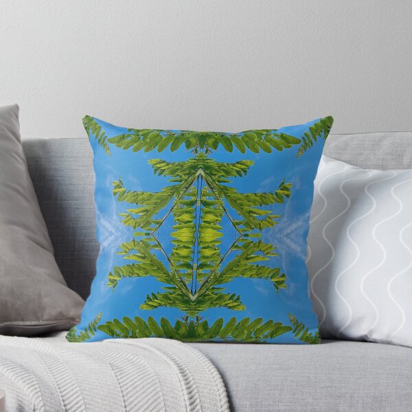 Item preview, Branch of green leaves against a blue sky, mirror image designed and sold by lyloubeaupere.