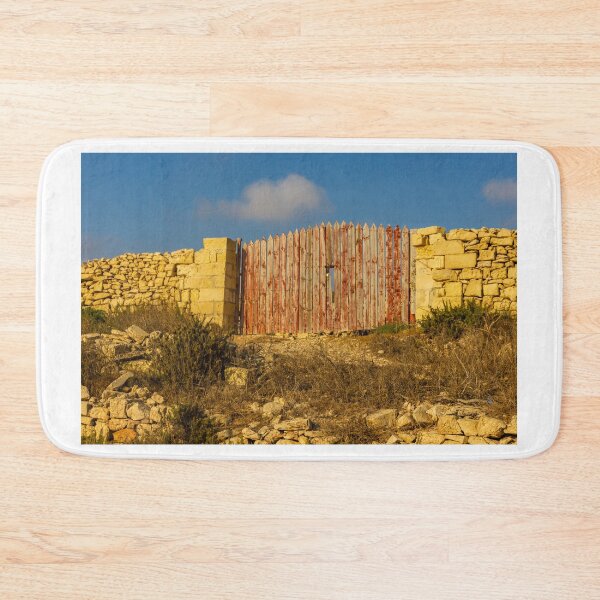 Item preview, Rustic Red Wooden Gate Set in Sunlit Stone Wall on a Dry Mediterranean Countryside designed and sold by Nmallia.