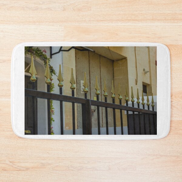 Item preview, Metal Fence With Gold Spiked Finials Along Building Exterior designed and sold by Nmallia.