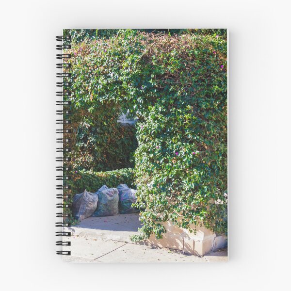 Item preview, Overgrown Ivy Arch Forms a Secluded Green Entrance Beside Trash Bags designed and sold by Nmallia.