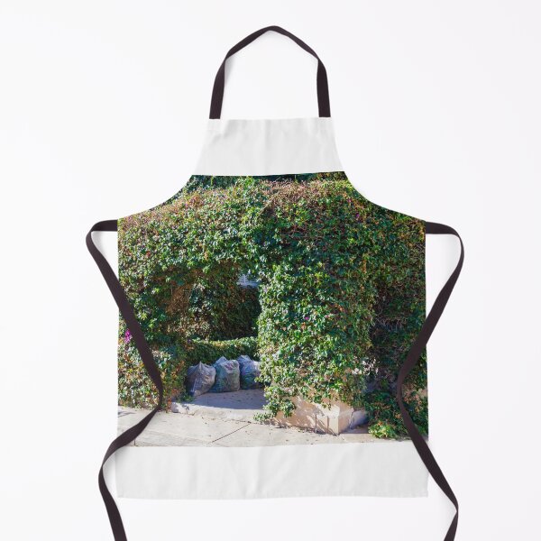 Item preview, Overgrown Ivy Arch Forms a Secluded Green Entrance Beside Trash Bags designed and sold by Nmallia.