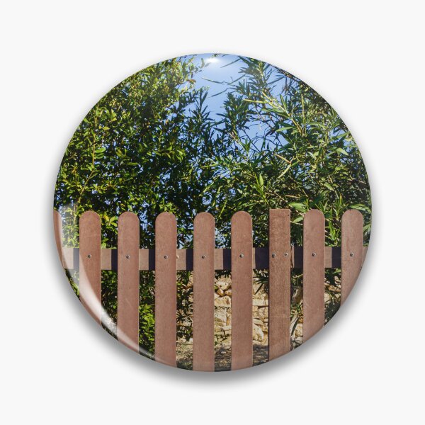 Item preview, Brown Wooden Picket Fence With Lush Greenery Behind In Sunny Outdoor Yard Near Olive Trees designed and sold by Nmallia.