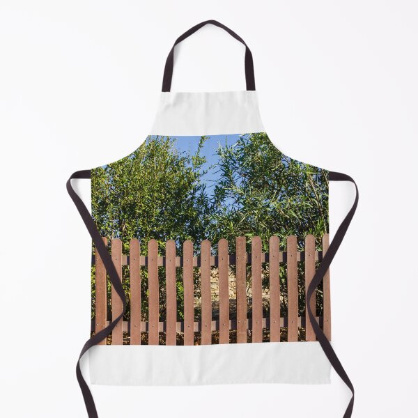 Item preview, Brown Wooden Picket Fence With Lush Greenery Behind In Sunny Outdoor Yard Near Olive Trees designed and sold by Nmallia.