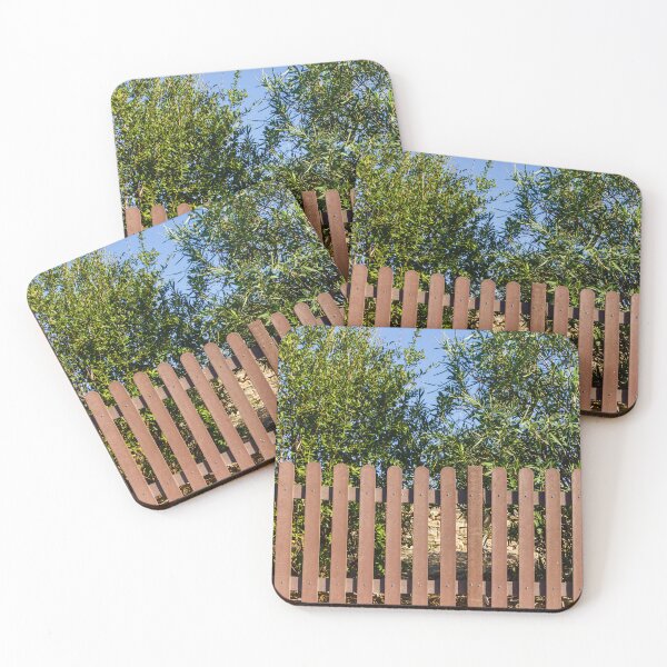 Item preview, Brown Wooden Picket Fence With Lush Greenery Behind In Sunny Outdoor Yard Near Olive Trees designed and sold by Nmallia.