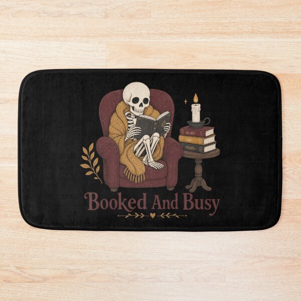 Item preview, Booked And Busy Shirt, Comfort Colors® Skeleton Reading Tee, Funny Halloween Book Lover Graphic designed and sold by TshirtsLabs.