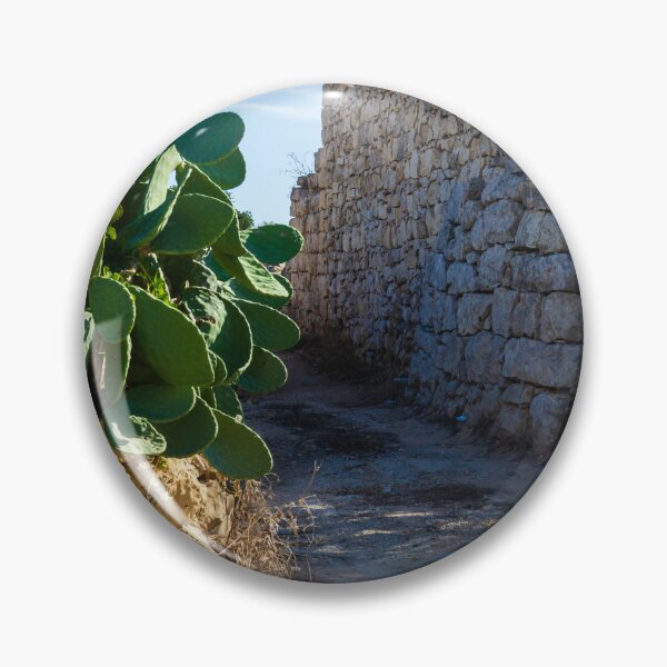 Item preview, Ancient Stone Wall Along a Desert Path with Cactus Plants Under Clear Sky designed and sold by Nmallia.