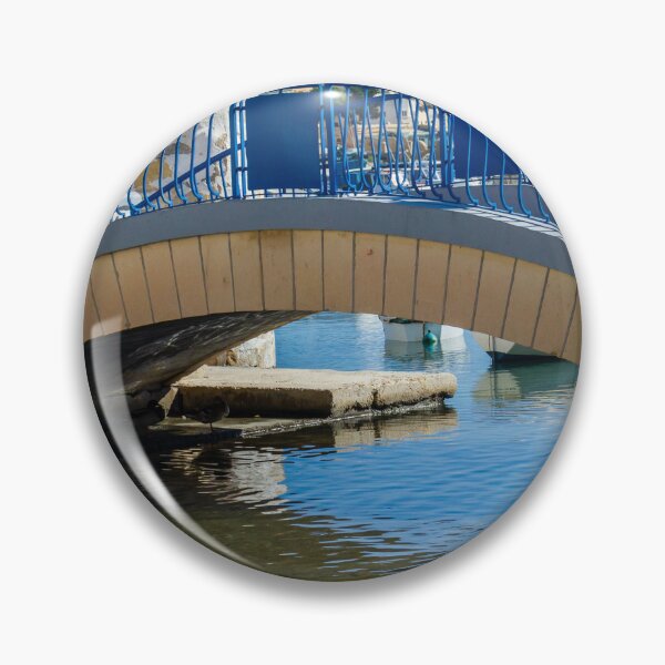 Item preview, Blue Arch Bridge Over Calm Harbor Water With City Buildings In Background designed and sold by Nmallia.