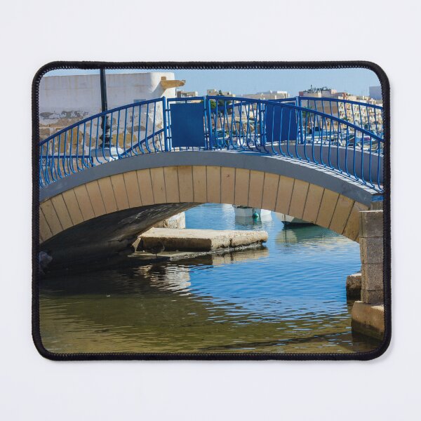 Item preview, Blue Arch Bridge Over Calm Harbor Water With City Buildings In Background designed and sold by Nmallia.