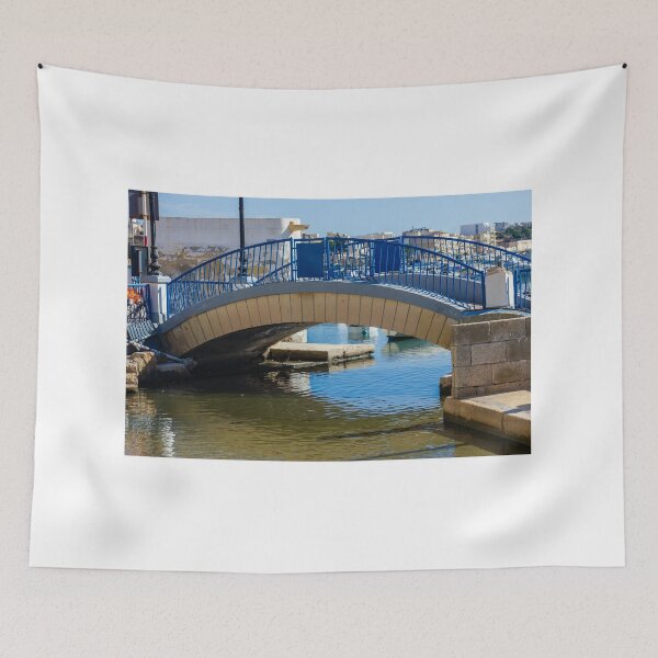 Item preview, Blue Arch Bridge Over Calm Harbor Water With City Buildings In Background designed and sold by Nmallia.