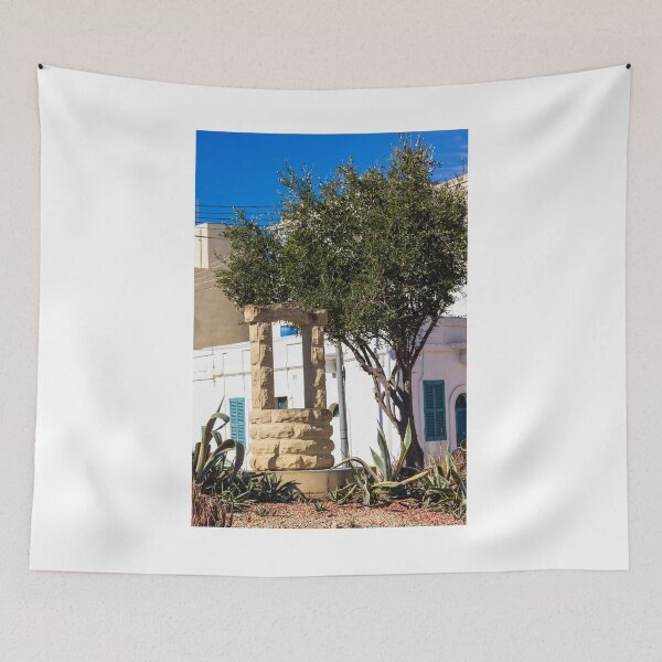 Item preview, Sunlit Stone Archway Garden With Olive Tree, White Mediterranean Buildings And Blue Shutters designed and sold by Nmallia.