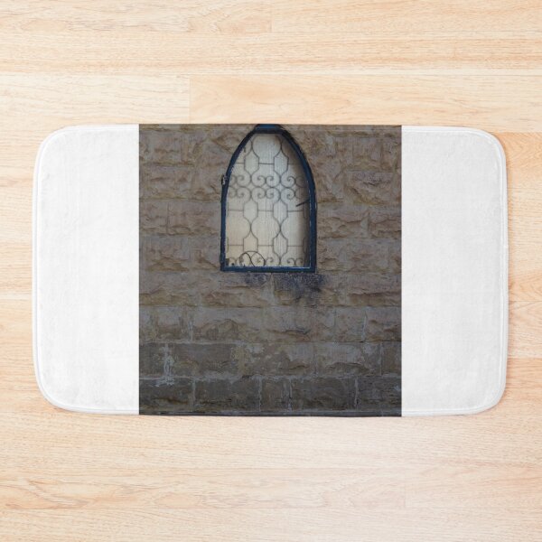 Item preview, Rustic Stone Wall With Arched Window And Decorative Iron Bars On Exterior Building designed and sold by Nmallia.
