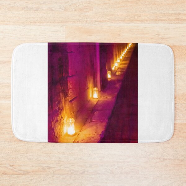 Item preview, Candlelit Alley At Night With Purple And Orange Hue, Warm Lanterns Along Stone Wall Glow designed and sold by Nmallia.