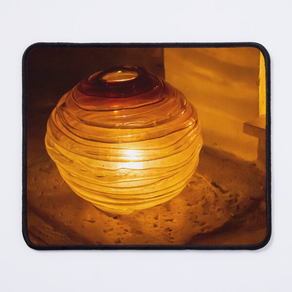 Item preview, Warm Amber Lantern Sits on Sandy Ground Providing Cozy Indoor-Outdoor Glow and Decor designed and sold by Nmallia.