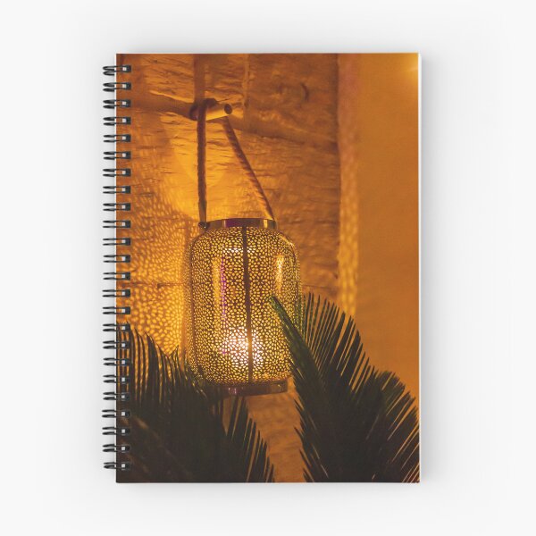 Item preview, Warm Moroccan Lantern Glow Illuminates Cozy Indoor Setting With Stone Wall and Palm Leaves designed and sold by Nmallia.