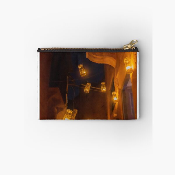 Item preview, Warm Amber Jar Lanterns Dangling Over Narrow Night Alley Creating Cozy Street Scene Atmosphere Warmth designed and sold by Nmallia.