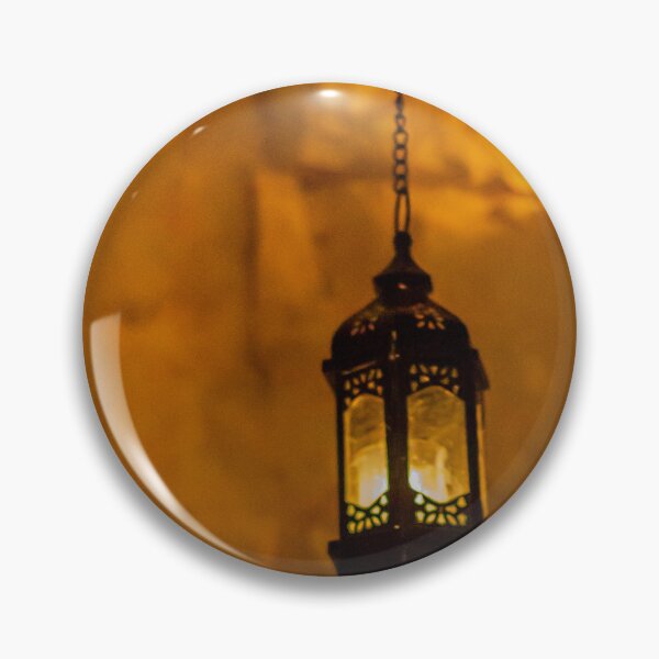Item preview, Vintage Hanging Lantern With Warm Amber Light Against a Stone Wall Interior designed and sold by Nmallia.